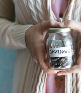 Woman Holding Savings Jar