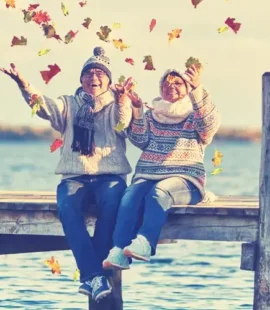 older couple sits on dock symbolizing how Retirement May Be Your Next Adventure
